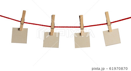 Set of blank notes held on string isolated 61970870