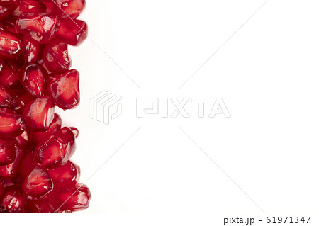 Ripe red  pomegranate seeds close up, to view , 61971347