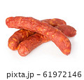 Stack of cooked sausages close-up isolated. 61972146