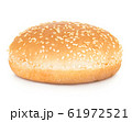 Burger bun with sesame seeds isolated on white. 61972521