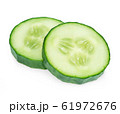 Fresh slice cucumber close-up on white. 61972676