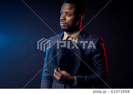 Cool african american man on dark background Cool african american man on dark background 61973698