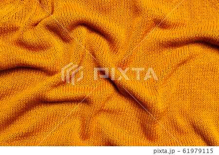 Top view of knitted orange wool fabric 61979115