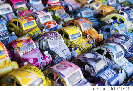 Colorful toy cars made from aluminium drink cans on sale at a market stall, Antananarivo, Madagascar Colorful toy cars made from aluminium drink cans on sale at a market stall, Antananarivo, Madagascar 61979371