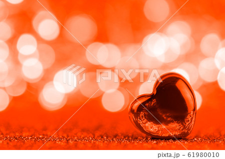 transparent heart against the background of the lights. trend colour 2020 lush lava transparent heart against the background of the lights. trend colour 2020 lush lava 61980010