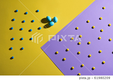 Candies in colorful sugar shell and eggs. 61980209