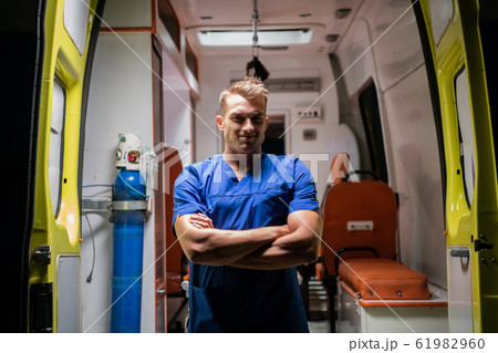 Man in medical uniform look at camera with smile 61982960