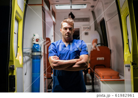 Man in medical uniform look at camera seriously Man in medical uniform look at camera seriously 61982961