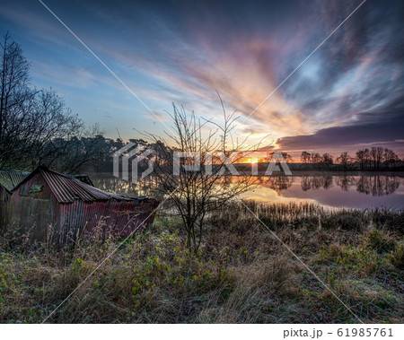 The old boat house at sunrise 61985761