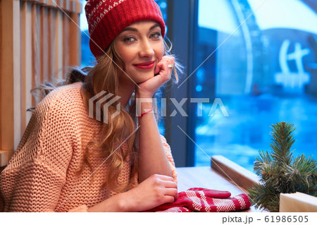 Beautiful caucasian blonde woman in red knitted Beautiful caucasian blonde woman in red knitted 61986505