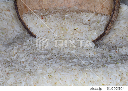 Close up Rice grain in coconut shell at thailand 61992504