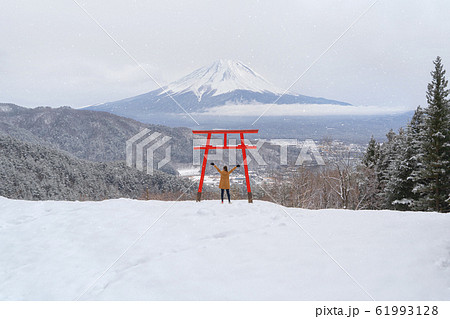 Asian woman tourist travel at Red Japanese Torii Asian woman tourist travel at Red Japanese Torii 61993128