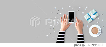 Smartphone with coffee and gift box 61994002