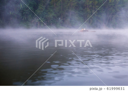 Water of lake with cold fog in winter. Water of lake with cold fog in winter. 61999631