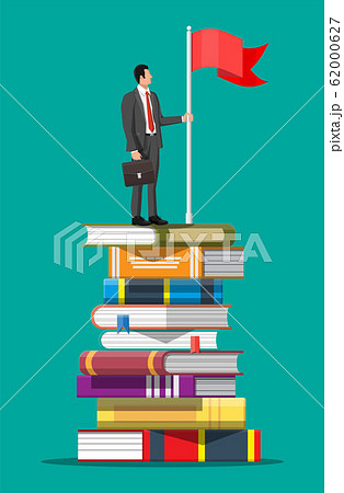 Businessman with flag on stack of books. 62000627