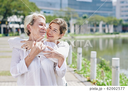 Woman hugging mature mother Woman hugging mature mother 62002577