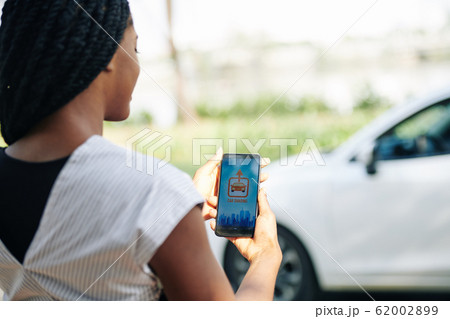 Woman using car sharing app 62002899