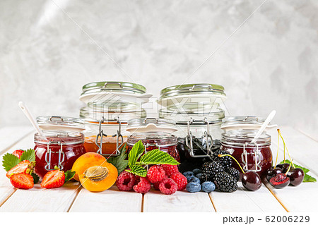 Selection of berry jams in glass jars Selection of berry jams in glass jars 62006229