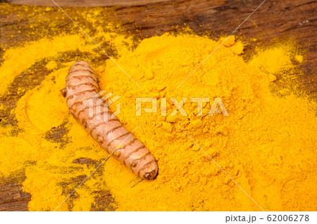 One fresh turmeric root an dried curcuma powder in One fresh turmeric root an dried curcuma powder in 62006278