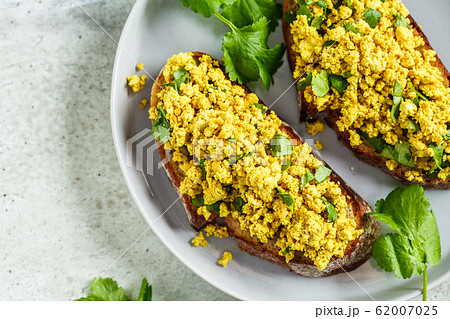 Tofu scramble sandwich on a gray plate. Vegan food Tofu scramble sandwich on a gray plate. Vegan food 62007025