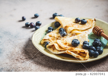Crepes with blueberries and honey. Crepes with blueberries and honey. 62007041