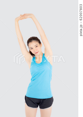 Beautiful young asian woman in sport standing stretch muscle arm workout with healthy isolated Beautiful young asian woman in sport standing stretch muscle arm workout with healthy isolated 62007803