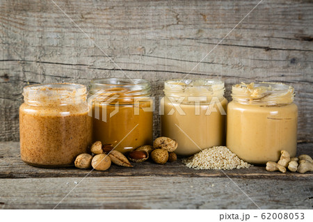 Selection of nut butters - peanut, cashew, almond and sesame seeds 62008053