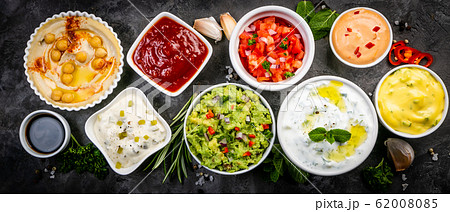 Selection of sauces in white bowls on white bowls 62008085