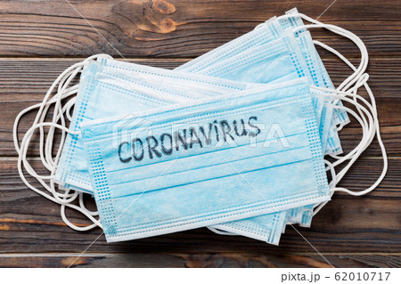 coronavirus word written on medical mask. coronavirus word written on medical mask. 62010717
