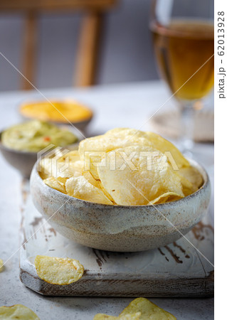 Crunchy delicious potato chips Crunchy delicious potato chips 62013928
