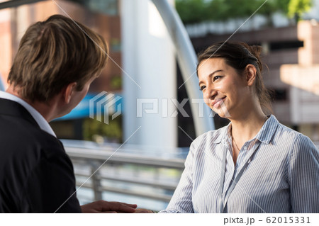 Happy Business team handshake in city 62015331