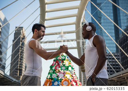 American sport athlete friends handshake in city 62015335