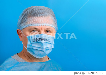 Portrait of ill man in medical unifrom and 62015385