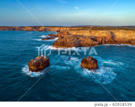 Aerial view on rock cliffs and waves 62018539