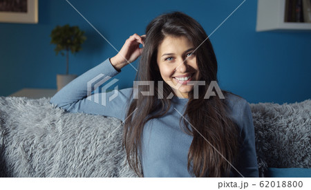 Smiling girl looking at camera 62018800