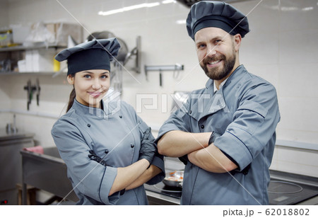 Two smiling crossed arms cooks Two smiling crossed arms cooks 62018802