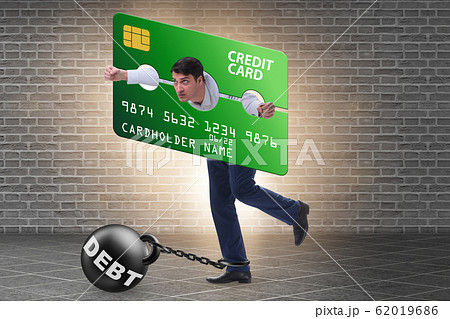 Businessman in credit card burden concept in pillory 62019686