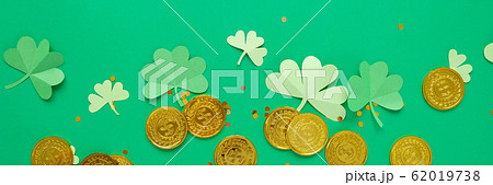 St. Patrick's day, clover and gold coins on a St. Patrick's day, clover and gold coins on a 62019738