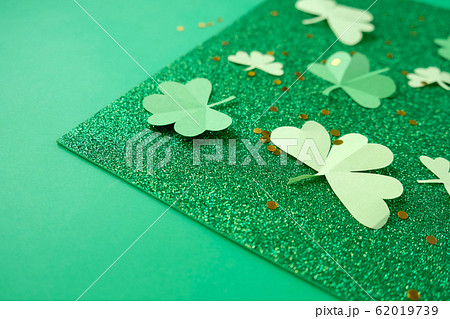 St. Patrick's day, clover on a green shiny St. Patrick's day, clover on a green shiny 62019739