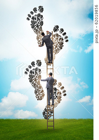 Carbon footprint concept with businessman Carbon footprint concept with businessman 62019856