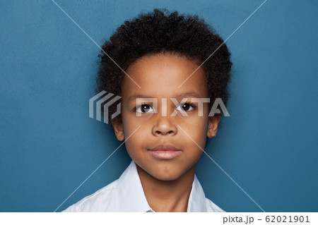 Clever black child student boy looking at camera Clever black child student boy looking at camera 62021901