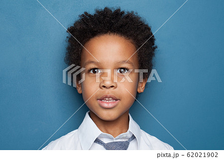 Little black kid boy student on blue background Little black kid boy student on blue background 62021902