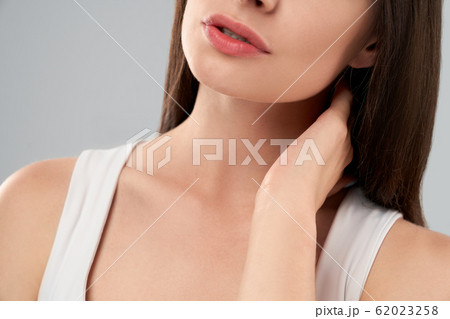 Woman showing pain in neck. 62023258