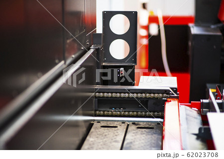 Sheet of metal and hands of worker who works on Sheet of metal and hands of worker who works on 62023708