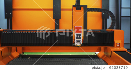 Sheet of metal and hands of worker who works on 62023719