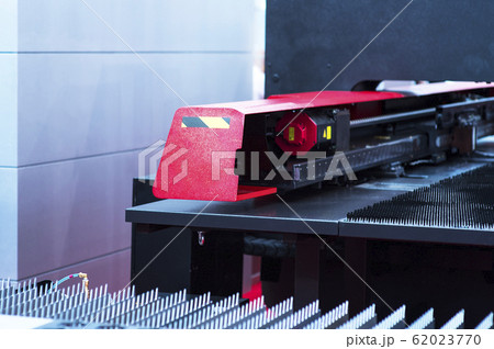 Sheet of metal and hands of worker who works on 62023770