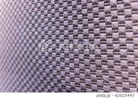 Light purple background of dense woven bagging fabric, closeup. Structure of the cloth with natural texture. Cloth backdrop. Light purple background of dense woven bagging fabric, closeup. Structure of the cloth with natural texture. Cloth backdrop. 62025447