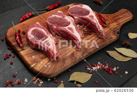 Raw Lamb Chops, Mutton Cuts or Sheep Ribs on Black Raw Lamb Chops, Mutton Cuts or Sheep Ribs on Black 62026530