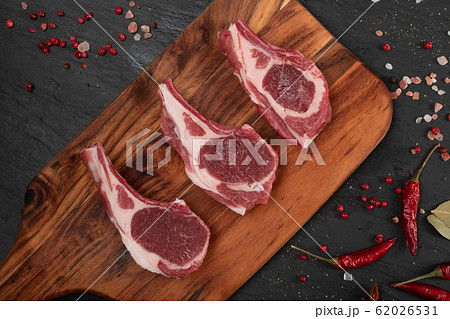 Raw Lamb Chops, Mutton Cuts or Sheep Ribs on Black Raw Lamb Chops, Mutton Cuts or Sheep Ribs on Black 62026531
