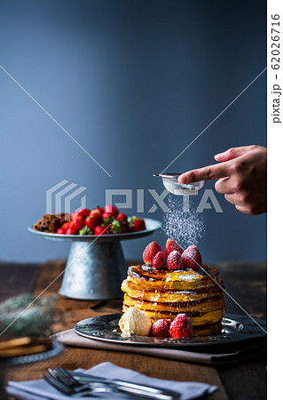 Strawberry pancakes with maple syrup 62026716